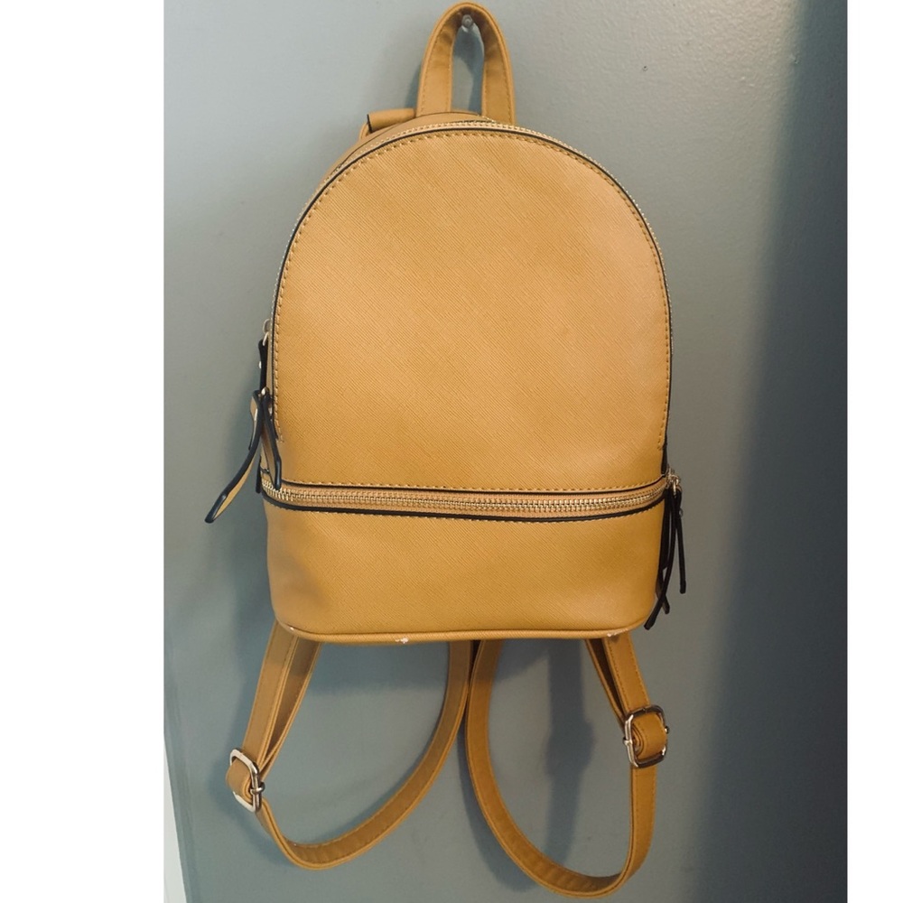 Artsy pho leather yellow mini backpack!